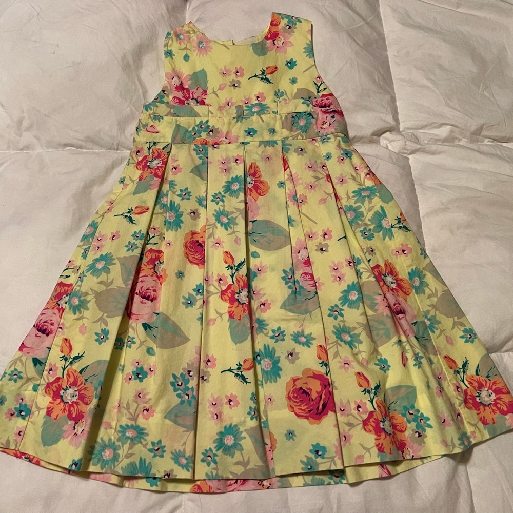 Yellow dress with flowers on it